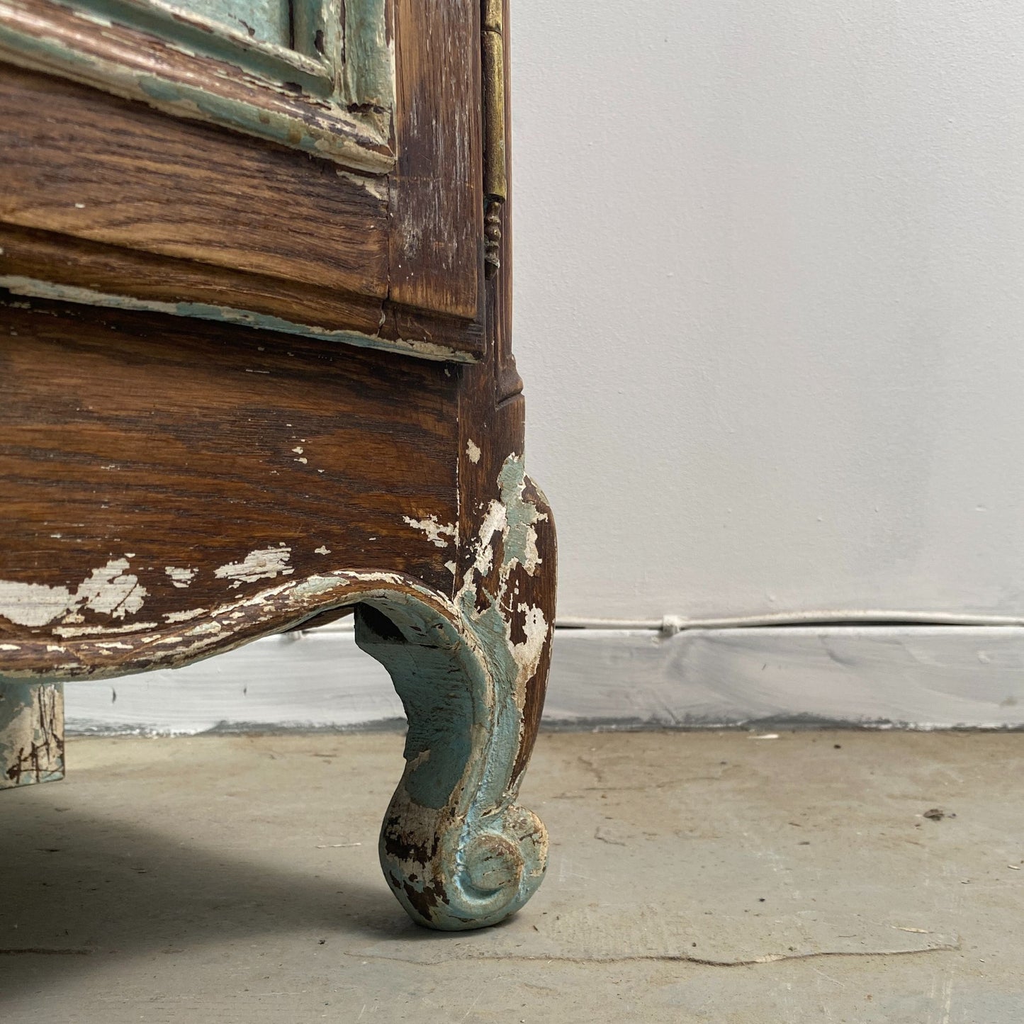 cabriole Foot Detail of a Stripped Oak Dresser with an aged patina in the style of a French Library