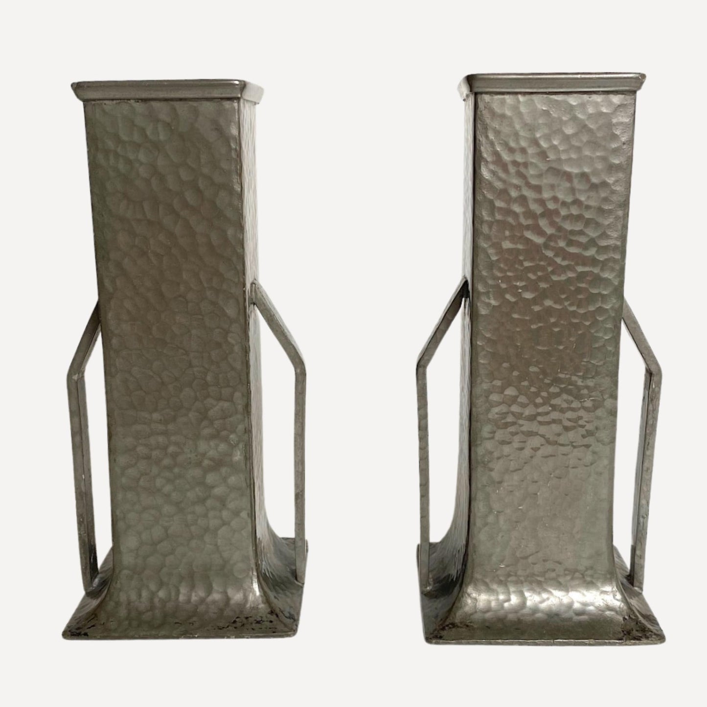 Pair of art deco vases, hand beaten pewter, makers stamp on the base, 20cm tall, 9cm wide, each with arm like handles on either side