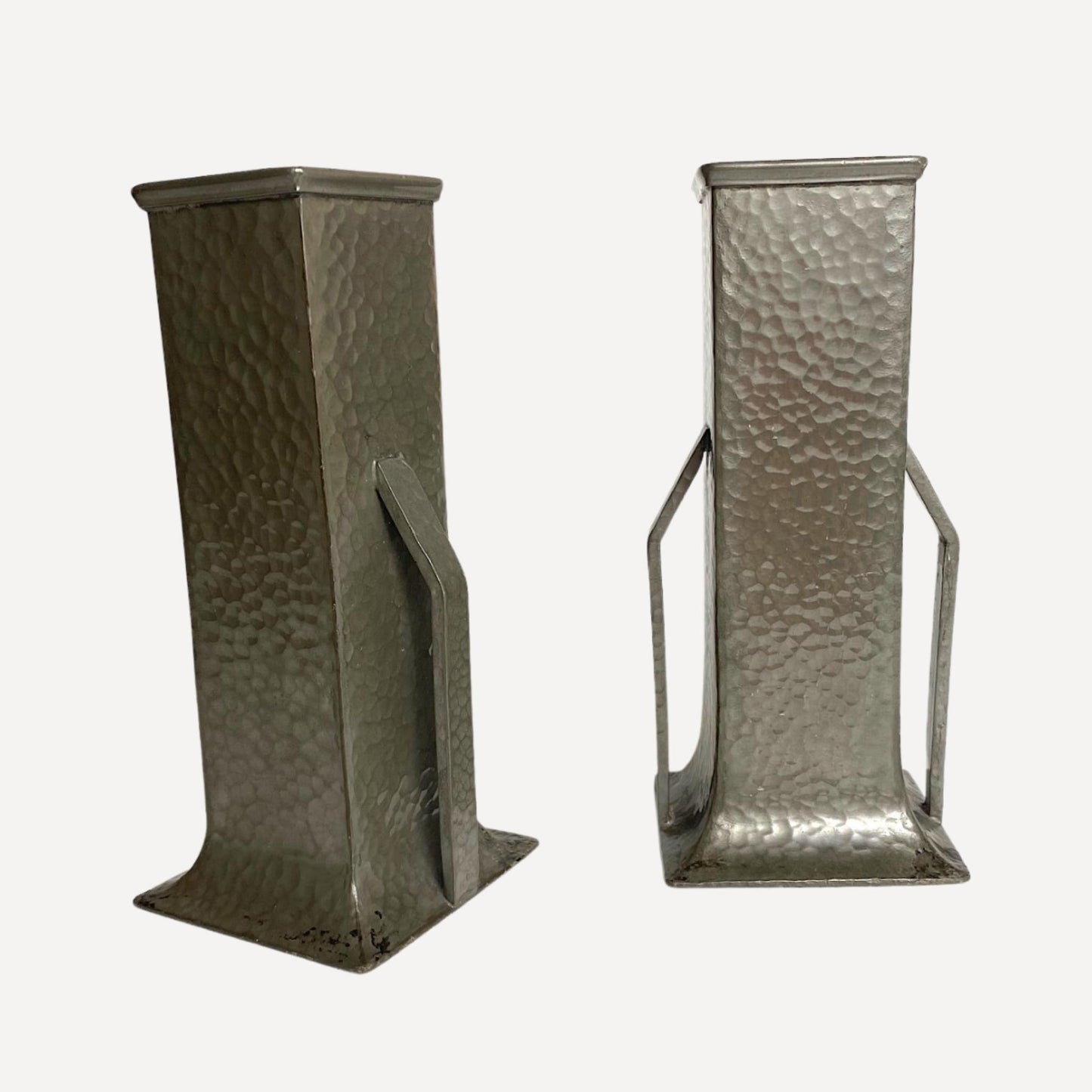 Pair of art deco vases, hand beaten pewter, makers stamp on the base, 20cm tall, 9cm wide, each with arm like handles on either side