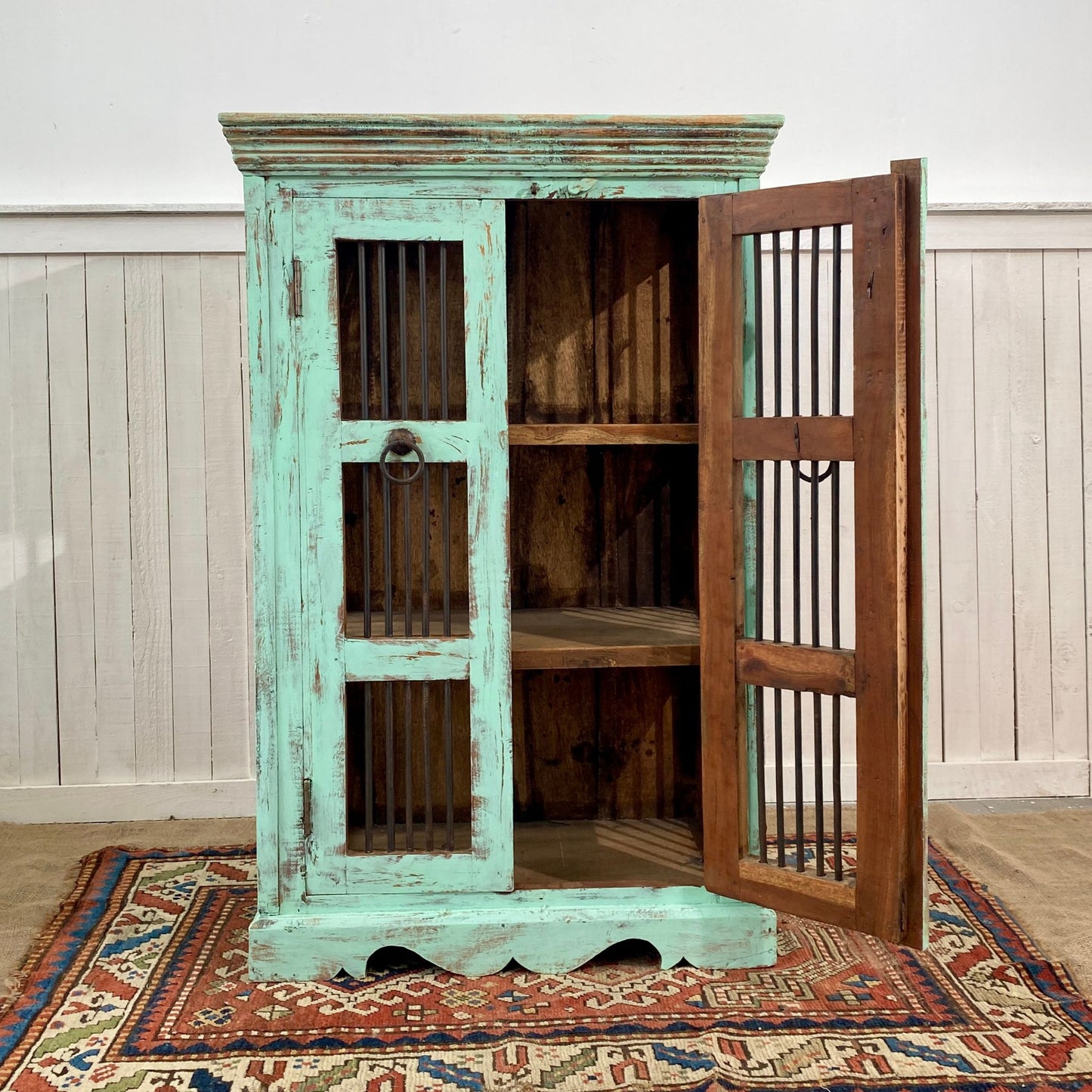 reclaimed antique indian teak wood jali sheesham cabinet painted in laurentian with a single door open