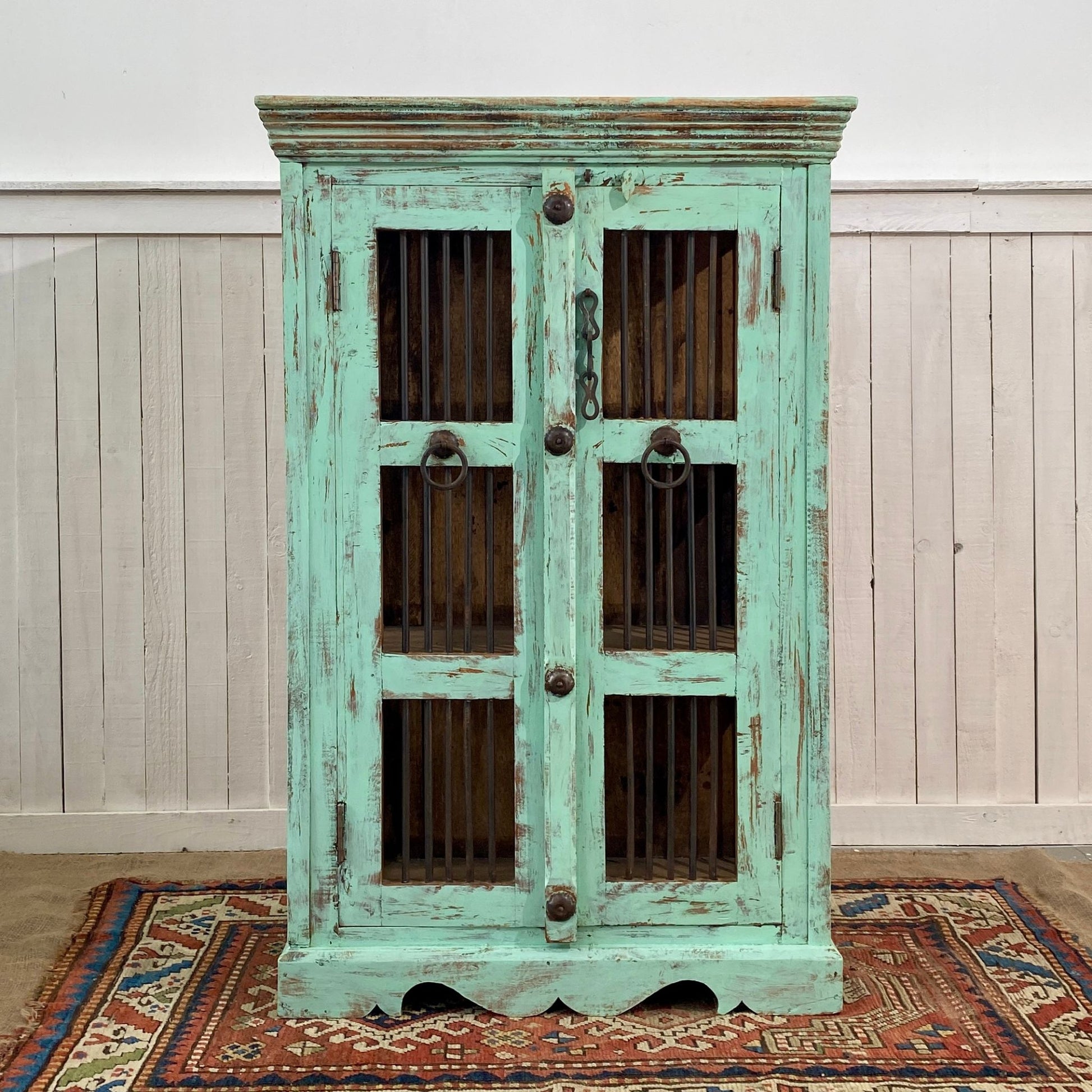 Vintage-style turquoise painted Indian Reclaimed Antique cabinet with metal handles.