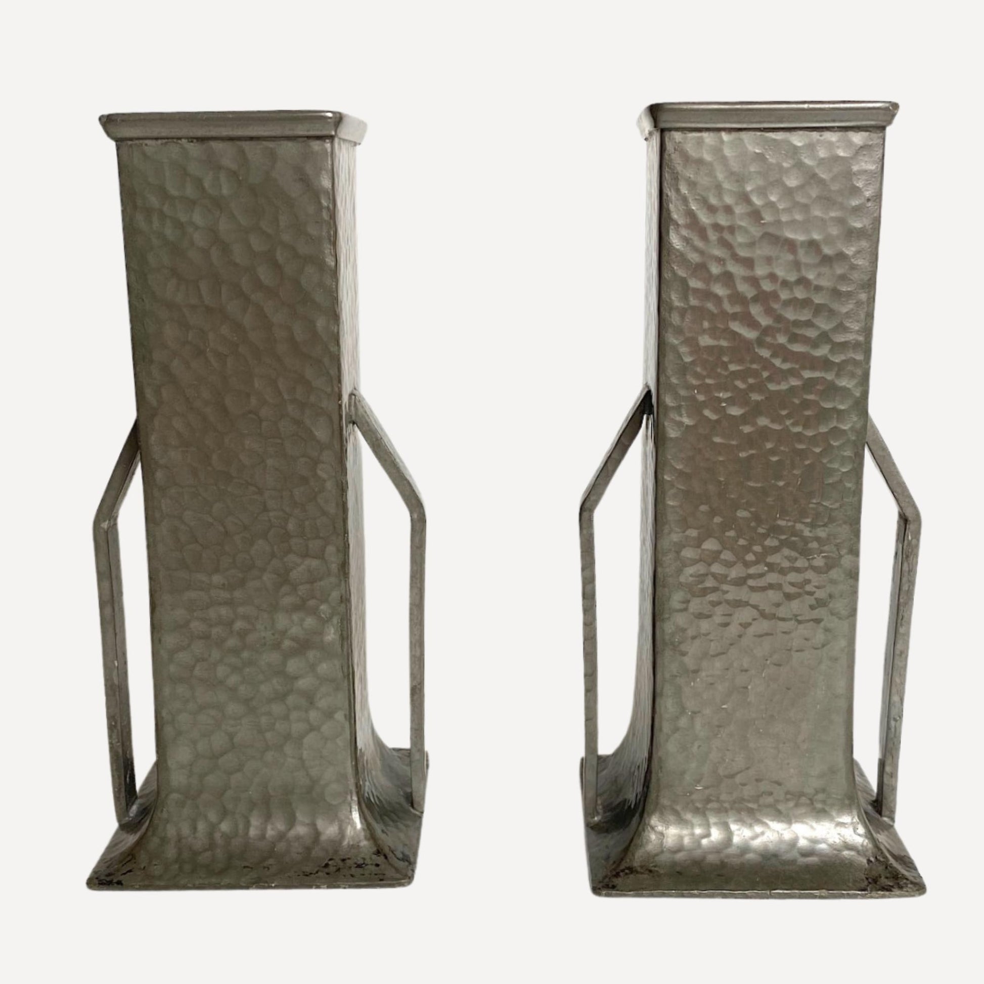 Pair of art deco vases, hand beaten pewter, makers stamp on the base, 20cm tall, 9cm wide, each with arm like handles on either side